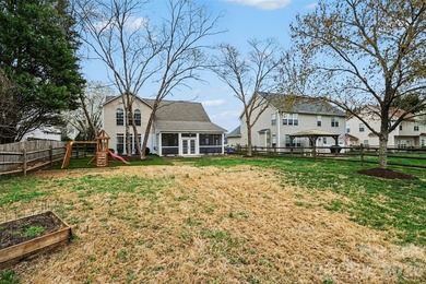 Set along the 4th tee of the golf course in the highly desirable on Highland Creek Golf Club in North Carolina - for sale on GolfHomes.com, golf home, golf lot