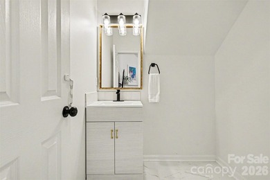 Set along the 4th tee of the golf course in the highly desirable on Highland Creek Golf Club in North Carolina - for sale on GolfHomes.com, golf home, golf lot