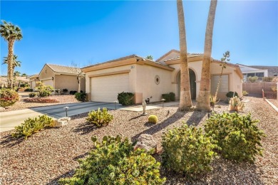 Nestled in the coveted Sun City MacDonald Ranch golf course on Desert Willow Golf Course in Nevada - for sale on GolfHomes.com, golf home, golf lot