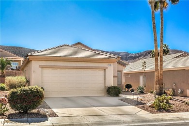 Nestled in the coveted Sun City MacDonald Ranch golf course on Desert Willow Golf Course in Nevada - for sale on GolfHomes.com, golf home, golf lot