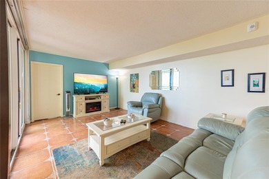 Step into paradise with this stunning 2-bedroom, 2-bathroom on Isla Del Sol Yacht and Country Club in Florida - for sale on GolfHomes.com, golf home, golf lot