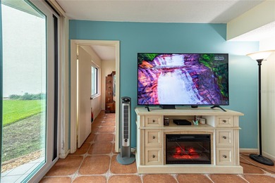 Step into paradise with this stunning 2-bedroom, 2-bathroom on Isla Del Sol Yacht and Country Club in Florida - for sale on GolfHomes.com, golf home, golf lot