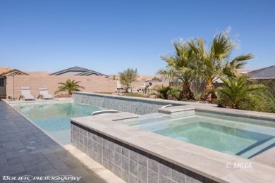 This exceptional one-level Cambria home is a true masterpiece on Wolf Creek At Paradise Canyon in Nevada - for sale on GolfHomes.com, golf home, golf lot