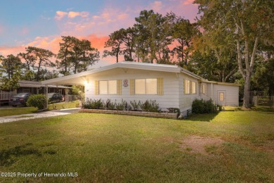 This 2 bedroom, 2 bath home with a covered carport wraps you in on High Point Golf Club, Inc. in Florida - for sale on GolfHomes.com, golf home, golf lot