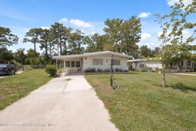 This 2 bedroom, 2 bath home with a covered carport wraps you in on High Point Golf Club, Inc. in Florida - for sale on GolfHomes.com, golf home, golf lot