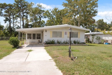 This 2 bedroom, 2 bath home with a covered carport wraps you in on High Point Golf Club, Inc. in Florida - for sale on GolfHomes.com, golf home, golf lot