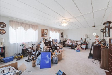 This 2 bedroom, 2 bath home with a covered carport wraps you in on High Point Golf Club, Inc. in Florida - for sale on GolfHomes.com, golf home, golf lot