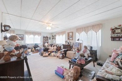This 2 bedroom, 2 bath home with a covered carport wraps you in on High Point Golf Club, Inc. in Florida - for sale on GolfHomes.com, golf home, golf lot