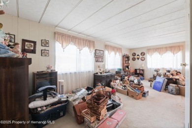This 2 bedroom, 2 bath home with a covered carport wraps you in on High Point Golf Club, Inc. in Florida - for sale on GolfHomes.com, golf home, golf lot