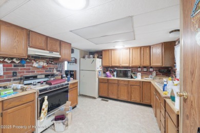 This 2 bedroom, 2 bath home with a covered carport wraps you in on High Point Golf Club, Inc. in Florida - for sale on GolfHomes.com, golf home, golf lot