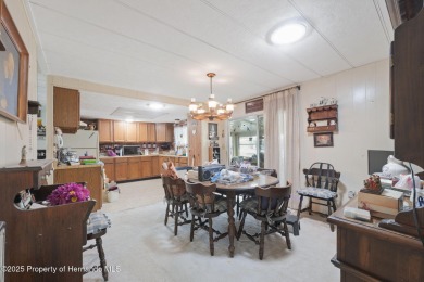 This 2 bedroom, 2 bath home with a covered carport wraps you in on High Point Golf Club, Inc. in Florida - for sale on GolfHomes.com, golf home, golf lot