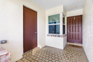 Nestled on a quiet street, this turnkey CBS townhouse has been on The Golf Club of Jupiter in Florida - for sale on GolfHomes.com, golf home, golf lot