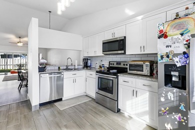 Nestled on a quiet street, this turnkey CBS townhouse has been on The Golf Club of Jupiter in Florida - for sale on GolfHomes.com, golf home, golf lot