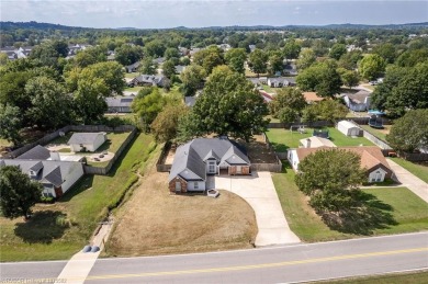 Eastside Greenwood Charmer with a tiled living room and on Vache-Grasse Country Club in Arkansas - for sale on GolfHomes.com, golf home, golf lot