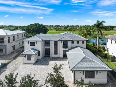 Welcome to your dream home in the exclusive Heron Estates. This on Heron Bay Golf Club in Florida - for sale on GolfHomes.com, golf home, golf lot