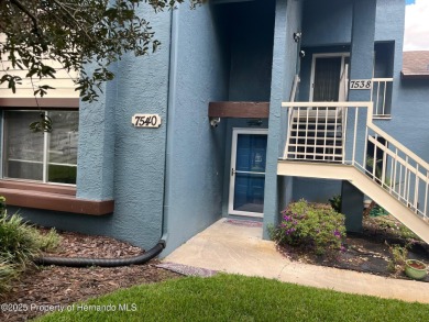 GROUND FLOOR CONDO located on the 8th Fairway of the Heather on Heather Golf and Country Club in Florida - for sale on GolfHomes.com, golf home, golf lot