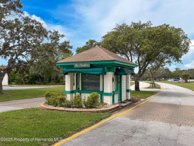 GROUND FLOOR CONDO located on the 8th Fairway of the Heather on Heather Golf and Country Club in Florida - for sale on GolfHomes.com, golf home, golf lot