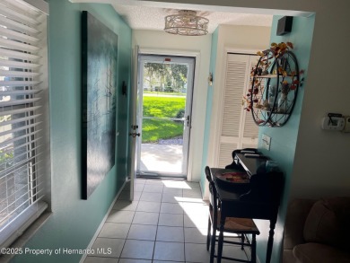 GROUND FLOOR CONDO located on the 8th Fairway of the Heather on Heather Golf and Country Club in Florida - for sale on GolfHomes.com, golf home, golf lot