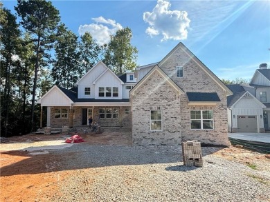 Exquisite Golf Course Retreat! Nestled on the pristine 3rd on Traditions of Braselton Golf Club in Georgia - for sale on GolfHomes.com, golf home, golf lot