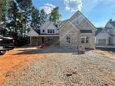 Exquisite Golf Course Retreat! Nestled on the pristine 3rd on Traditions of Braselton Golf Club in Georgia - for sale on GolfHomes.com, golf home, golf lot