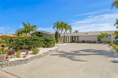 The ultimate Live-Work-Play lifestyle awaits in this beautifully on Isla Del Sol Yacht and Country Club in Florida - for sale on GolfHomes.com, golf home, golf lot