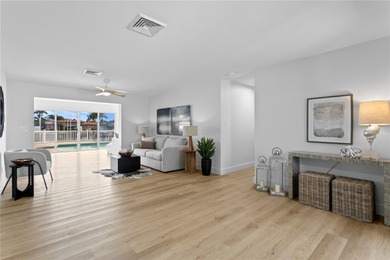 The ultimate Live-Work-Play lifestyle awaits in this beautifully on Isla Del Sol Yacht and Country Club in Florida - for sale on GolfHomes.com, golf home, golf lot