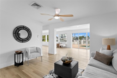 The ultimate Live-Work-Play lifestyle awaits in this beautifully on Isla Del Sol Yacht and Country Club in Florida - for sale on GolfHomes.com, golf home, golf lot