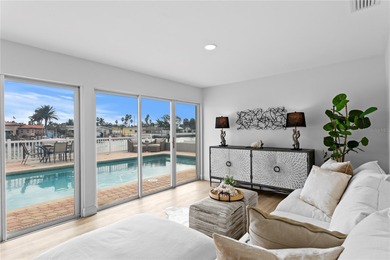 The ultimate Live-Work-Play lifestyle awaits in this beautifully on Isla Del Sol Yacht and Country Club in Florida - for sale on GolfHomes.com, golf home, golf lot