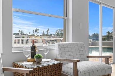 The ultimate Live-Work-Play lifestyle awaits in this beautifully on Isla Del Sol Yacht and Country Club in Florida - for sale on GolfHomes.com, golf home, golf lot