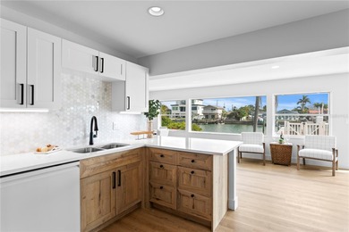 The ultimate Live-Work-Play lifestyle awaits in this beautifully on Isla Del Sol Yacht and Country Club in Florida - for sale on GolfHomes.com, golf home, golf lot