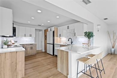 The ultimate Live-Work-Play lifestyle awaits in this beautifully on Isla Del Sol Yacht and Country Club in Florida - for sale on GolfHomes.com, golf home, golf lot