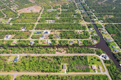 Seize the opportunity to own a prime .46-acre waterfront lot on Sabal Trace Golf and Country Club in Florida - for sale on GolfHomes.com, golf home, golf lot