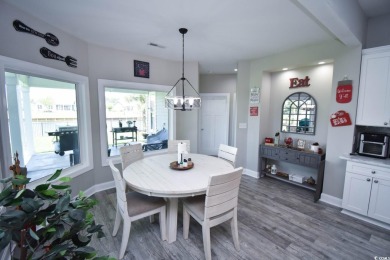 This beautifully landscaped property is situated directly on the on Wild Wing Plantation in South Carolina - for sale on GolfHomes.com, golf home, golf lot