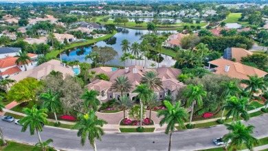 Situated on a double-lot with expansive lake views, highly on Broken Sound Golf and Club  in Florida - for sale on GolfHomes.com, golf home, golf lot