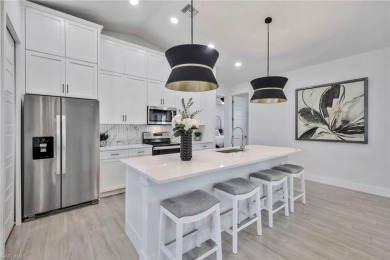 Experience modern Florida living at its finest in this stunning on Raptor Bay Golf Club in Florida - for sale on GolfHomes.com, golf home, golf lot