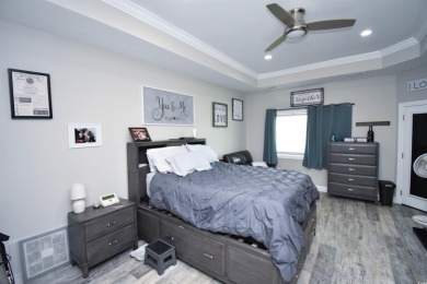 This beautifully landscaped property is situated directly on the on Wild Wing Plantation in South Carolina - for sale on GolfHomes.com, golf home, golf lot
