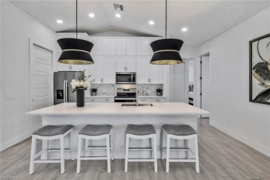 Experience modern Florida living at its finest in this stunning on Raptor Bay Golf Club in Florida - for sale on GolfHomes.com, golf home, golf lot