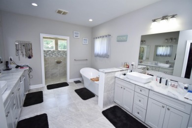 This beautifully landscaped property is situated directly on the on Wild Wing Plantation in South Carolina - for sale on GolfHomes.com, golf home, golf lot