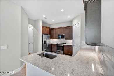 The Arbor II Townhome features a low-maintenance design with a on Plantation Bay Golf and Country Club in Florida - for sale on GolfHomes.com, golf home, golf lot