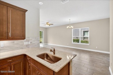 The Arbor II Townhome features a low-maintenance design with a on Plantation Bay Golf and Country Club in Florida - for sale on GolfHomes.com, golf home, golf lot