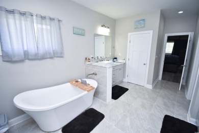 This beautifully landscaped property is situated directly on the on Wild Wing Plantation in South Carolina - for sale on GolfHomes.com, golf home, golf lot