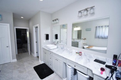 This beautifully landscaped property is situated directly on the on Wild Wing Plantation in South Carolina - for sale on GolfHomes.com, golf home, golf lot