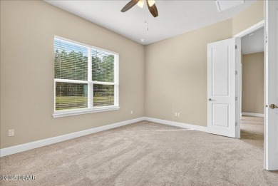 The Arbor II Townhome features a low-maintenance design with a on Plantation Bay Golf and Country Club in Florida - for sale on GolfHomes.com, golf home, golf lot