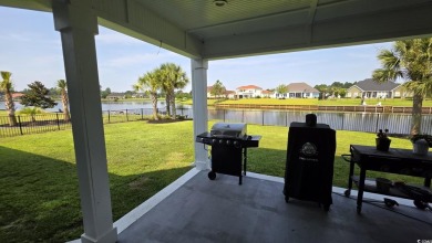 This beautifully landscaped property is situated directly on the on Wild Wing Plantation in South Carolina - for sale on GolfHomes.com, golf home, golf lot