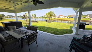 This beautifully landscaped property is situated directly on the on Wild Wing Plantation in South Carolina - for sale on GolfHomes.com, golf home, golf lot