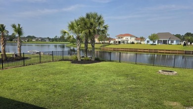 This beautifully landscaped property is situated directly on the on Wild Wing Plantation in South Carolina - for sale on GolfHomes.com, golf home, golf lot