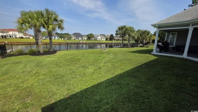 This beautifully landscaped property is situated directly on the on Wild Wing Plantation in South Carolina - for sale on GolfHomes.com, golf home, golf lot