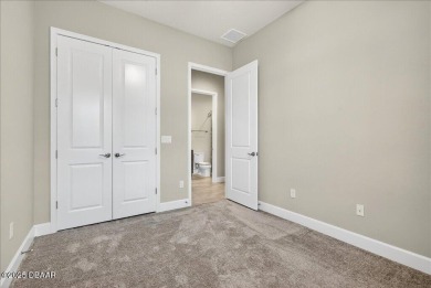 The Arbor II Townhome features a low-maintenance design with a on Plantation Bay Golf and Country Club in Florida - for sale on GolfHomes.com, golf home, golf lot