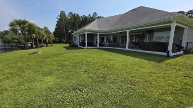 This beautifully landscaped property is situated directly on the on Wild Wing Plantation in South Carolina - for sale on GolfHomes.com, golf home, golf lot