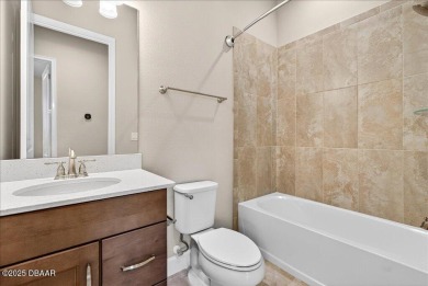 The Arbor II Townhome features a low-maintenance design with a on Plantation Bay Golf and Country Club in Florida - for sale on GolfHomes.com, golf home, golf lot